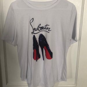Woman’s L soft shirt with heels design on it.
